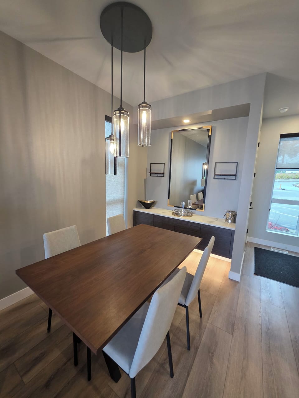 Dining area. Fully stocked with higher end serving dishes and coffee bar.