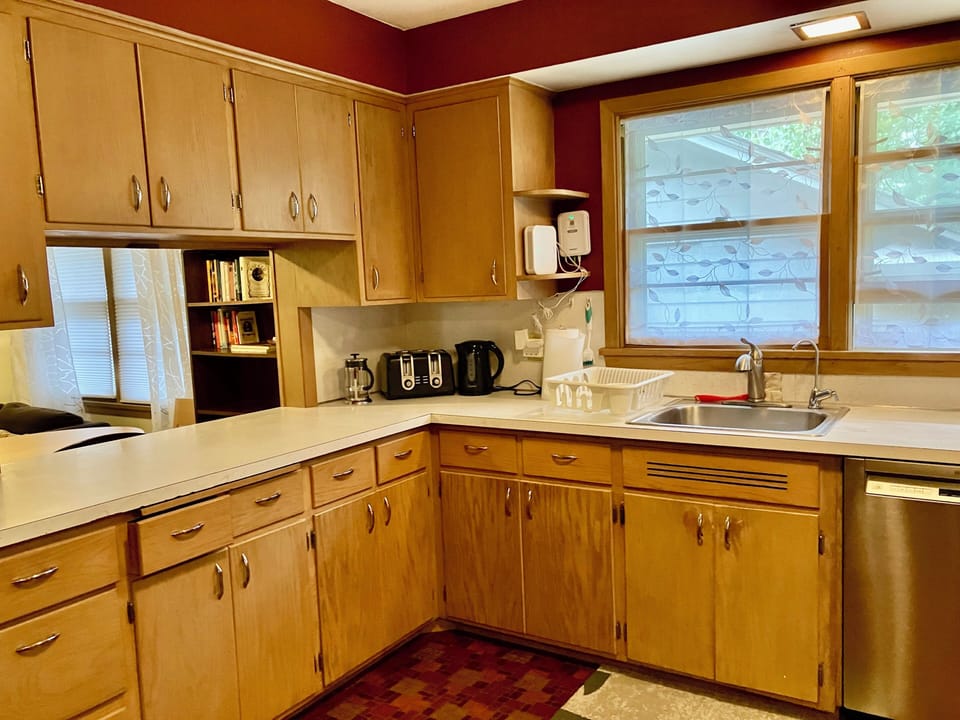 Kitchen features lots of cabinet and counter space with newer SS appliances.