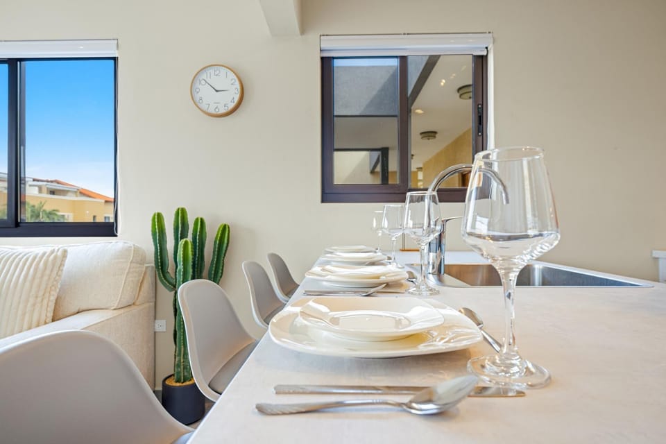 Open concept living at its best. Serve up dinner at the chic breakfast bar, then step right out onto the balcony for an after-dinner drink. This is vacation living designed for connection and ease.