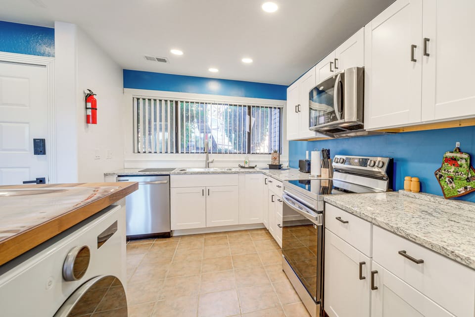 1st-floor kitchen fully equipped w/ a dishwasher, electric stove & microwave