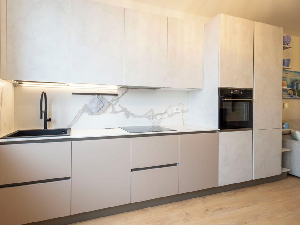 Kitchen, Flooring, Kitchen Appliance, Countertop, Wood, Interior Design, Floor, Cabinetry, Major Appliance, Home Appliance