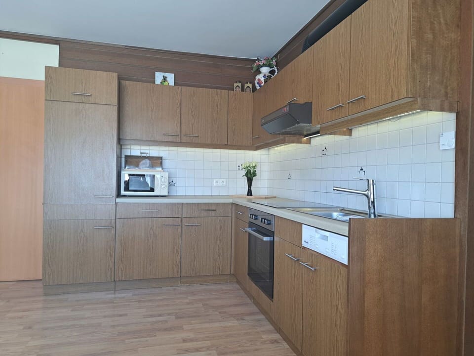 Countertop, Cabinetry, Kitchen, Flooring, Wood, Kitchen Appliance, Furniture, Interior Design, Floor, Major Appliance