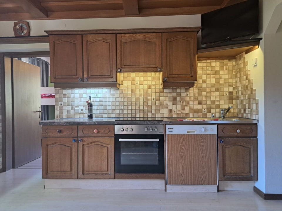 Kitchen, Countertop, Cabinetry, Kitchen Appliance, Flooring, Wood, Major Appliance, Interior Design, Cupboard, Floor
