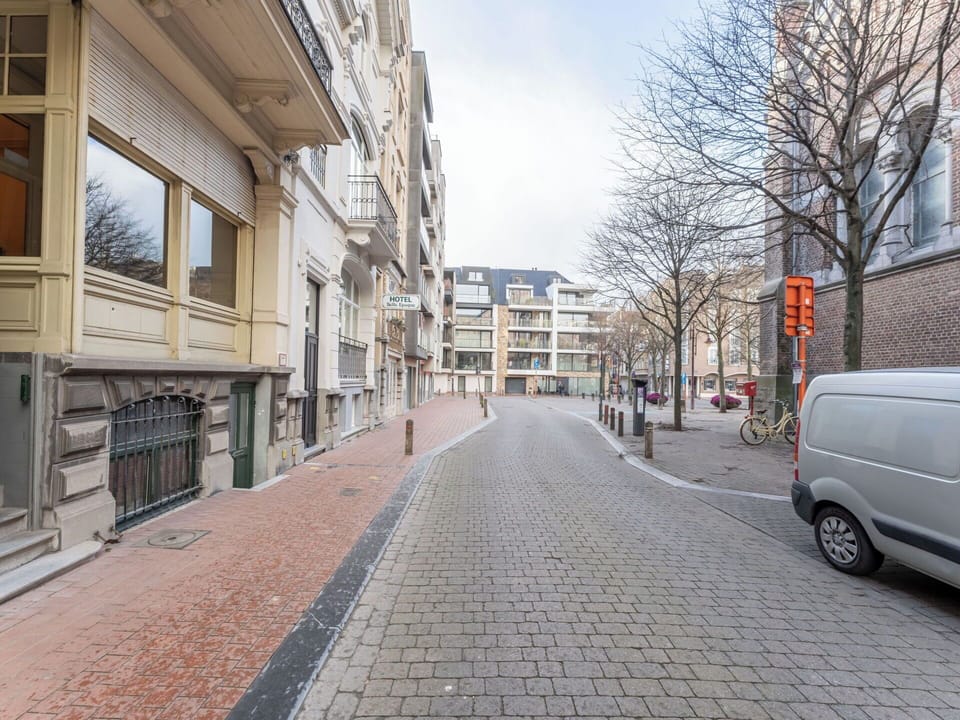 Building, Window, Road Surface, City, Residential Area, Apartment, Urban Area, Road, Street, Neighbourhood