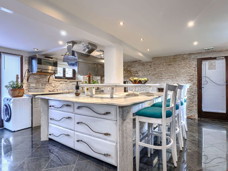 Furniture, Flooring, Interior Design, Countertop, Wood, Ceiling, Kitchen, Floor, Light Fixture, Lighting