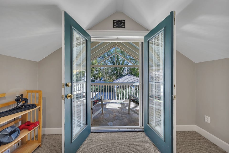 Light-filled French doors leading out to a breezy balcony