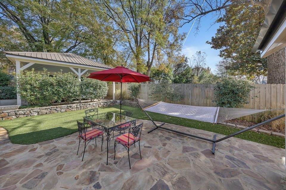 Backyard patio w/ hammock & umbrella for laid-back afternoons