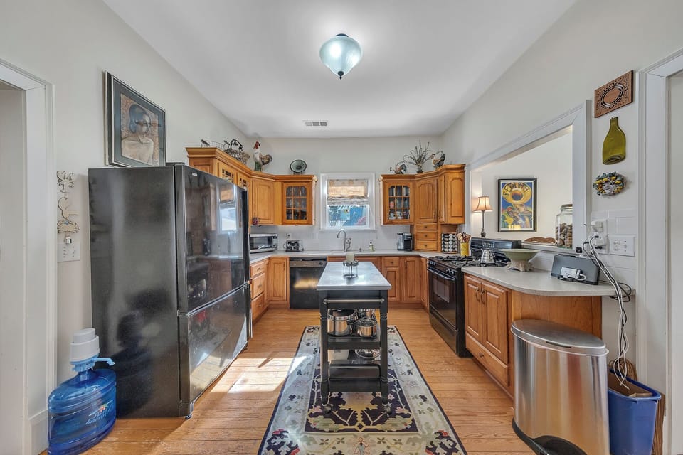 Full kitchen w/ ample counter space, stainless appliances & center island