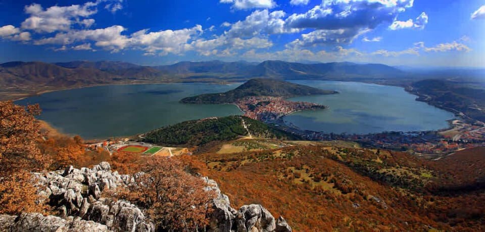 Stunning panoramic view of Lake Kastoria, surrounded by mountains and the charming lakeside town.