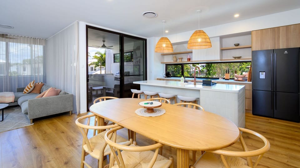 Sun-filled living and dining space overlooking the garden.