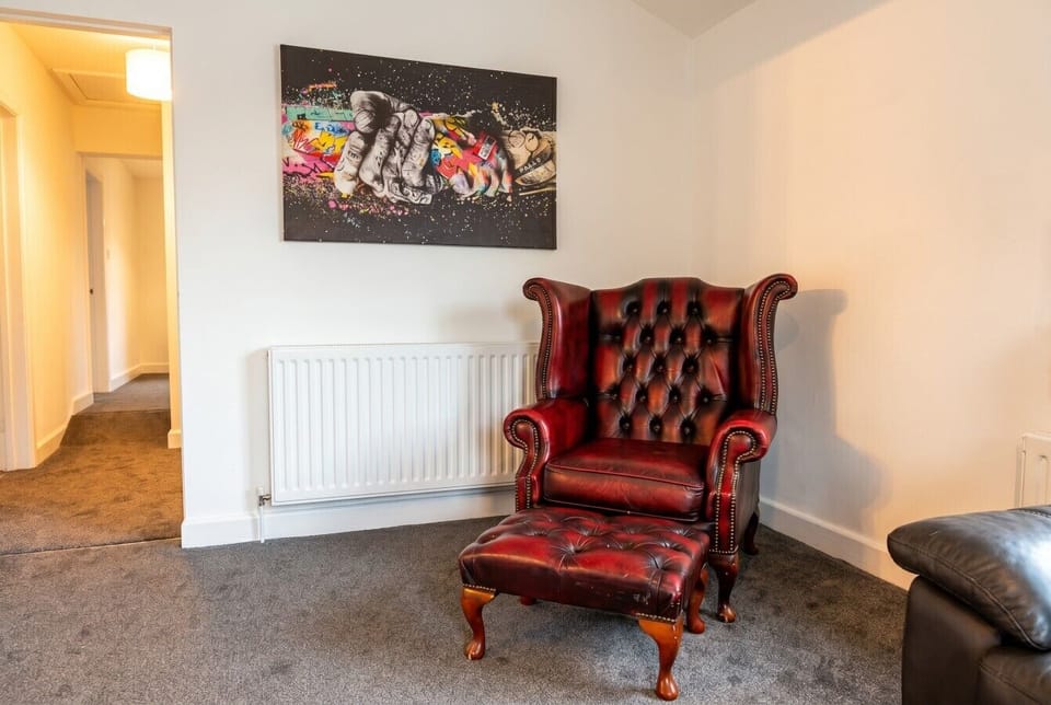 Antique leather armchair tucked in a quiet corner, perfect for reading.