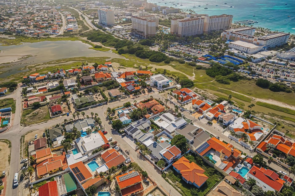 Neighborhood aerial view showing proximity to beaches and resorts