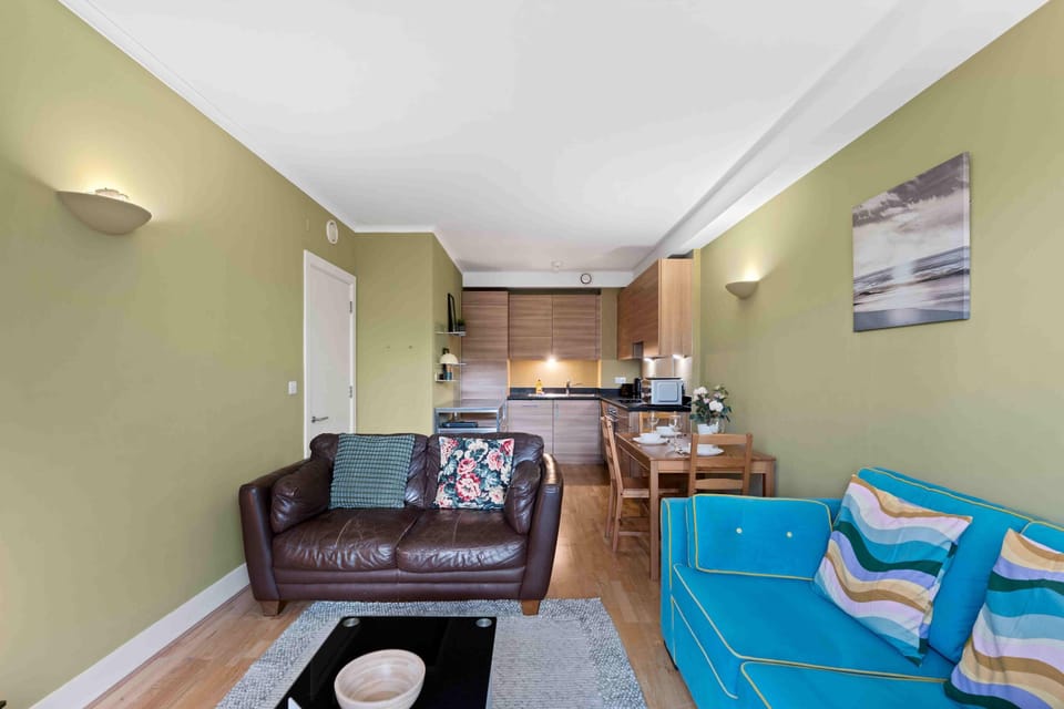 Spacious living area combining a sleek fitted kitchen and lounge space ideal for relaxing and socialising