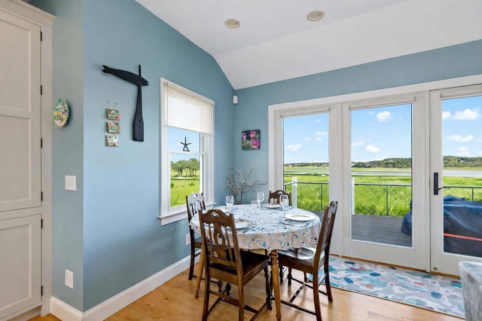 Sunny dining area off the kitchen with seating for the group, perfect for vacation meals after days on Indian Neck beaches.