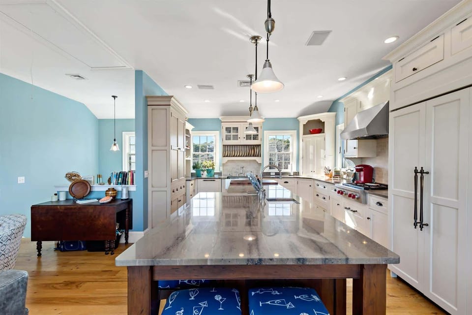 Second-floor kitchen with peninsula seating, stainless appliances, and plenty of prep space for Wellfleet oysters and Cape Cod seafood dinners.