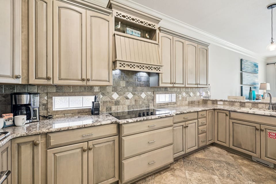 Your spacious kitchen features granite counters, custom cabinetry, and everything you need to create memorable meals during your stay.