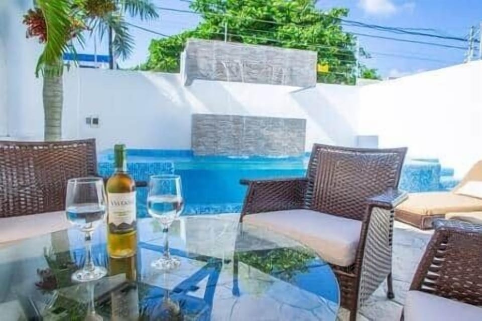 Day or night, it's always a good time for a glass of wine by the pool. 