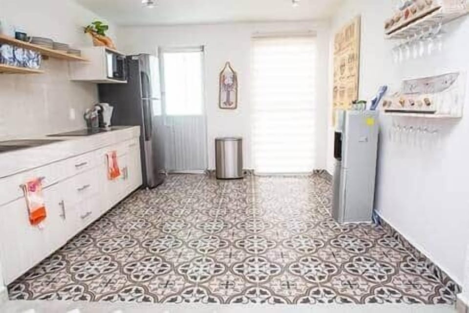 Spacious kitchen fully stocked with dishes and utensils for all your needs.