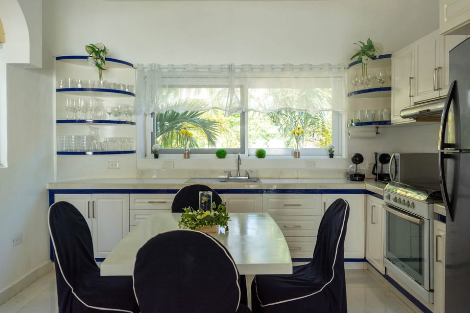 The kitchen is bright and airy, perfect for morning coffee, breakfasts, and home cooked meals!