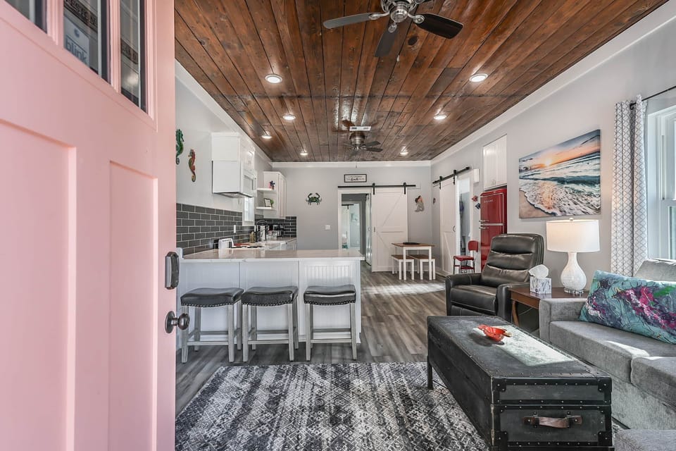 Upon entry you'll find cozy living area, breakfast bar, and kitchen.