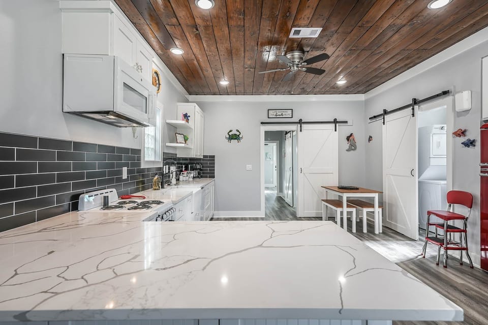 This renovated kitchen features marble countertops, and on old-style flair you're sure to love!