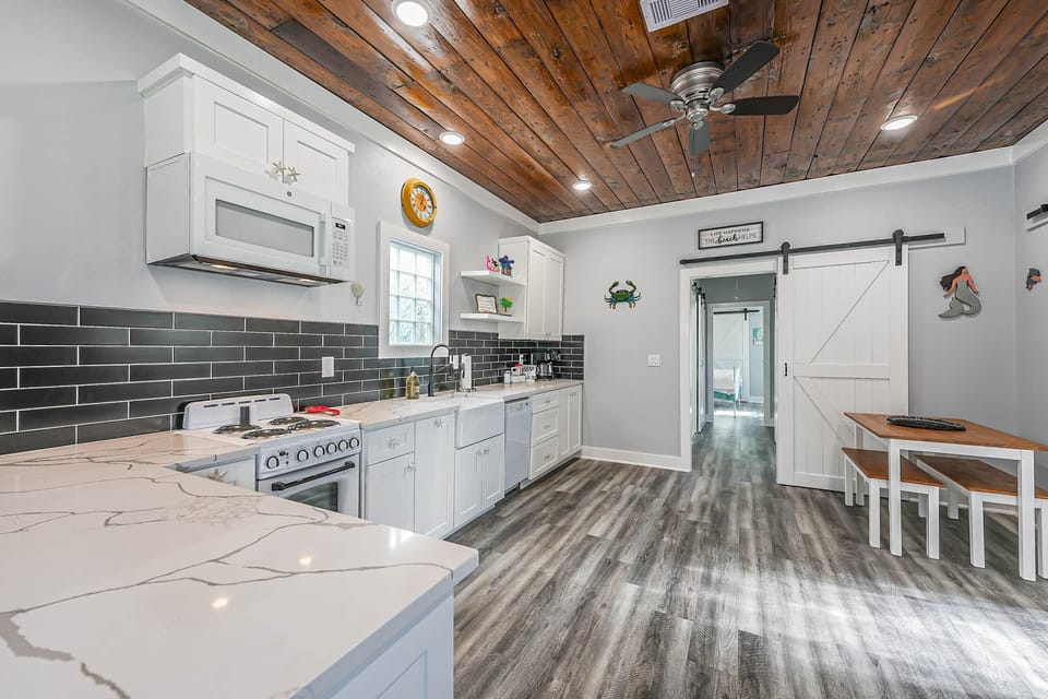 The gorgeous kitchen is fully stocked with everything you'll need for home cooked meals!