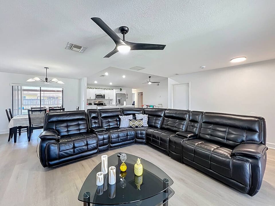 Leather sofa with three recliners wireless charging, cup holders usb ports- usbc Storage , Smart Tv with Xbox gaming console.