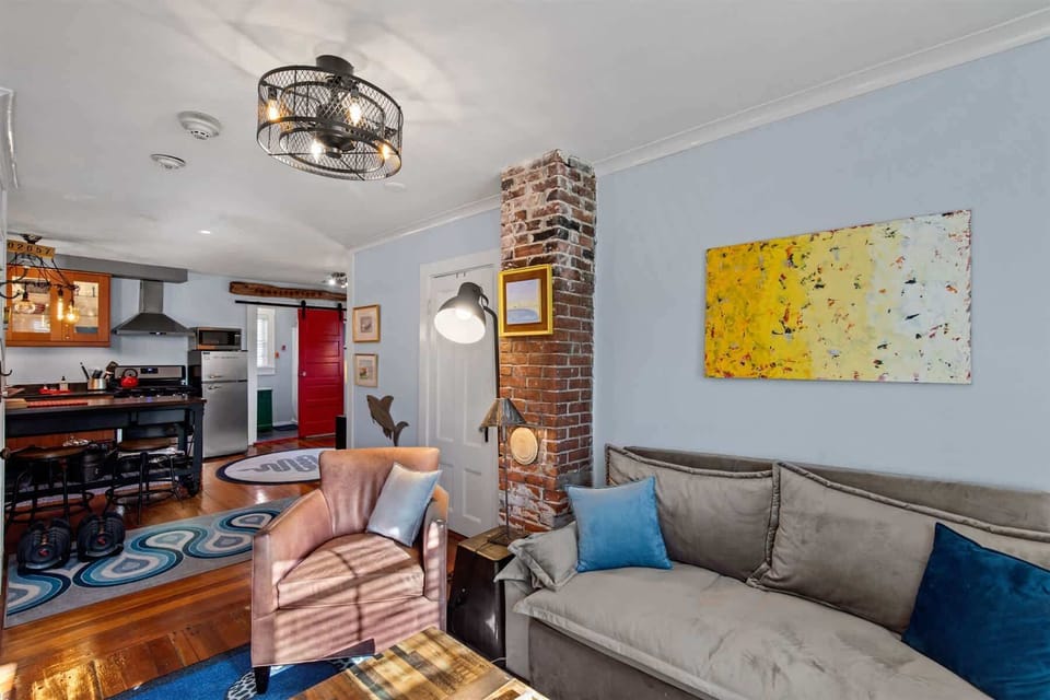 Another view of the open-concept living area, seamlessly connecting the living room and kitchen for easy entertaining and conversation.