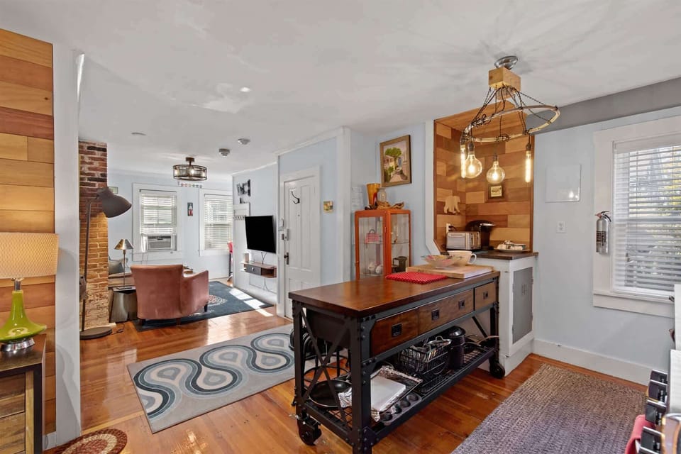 Wide-angle view of the kitchen showing generous counter space, ideal for preparing fresh local seafood from nearby markets.