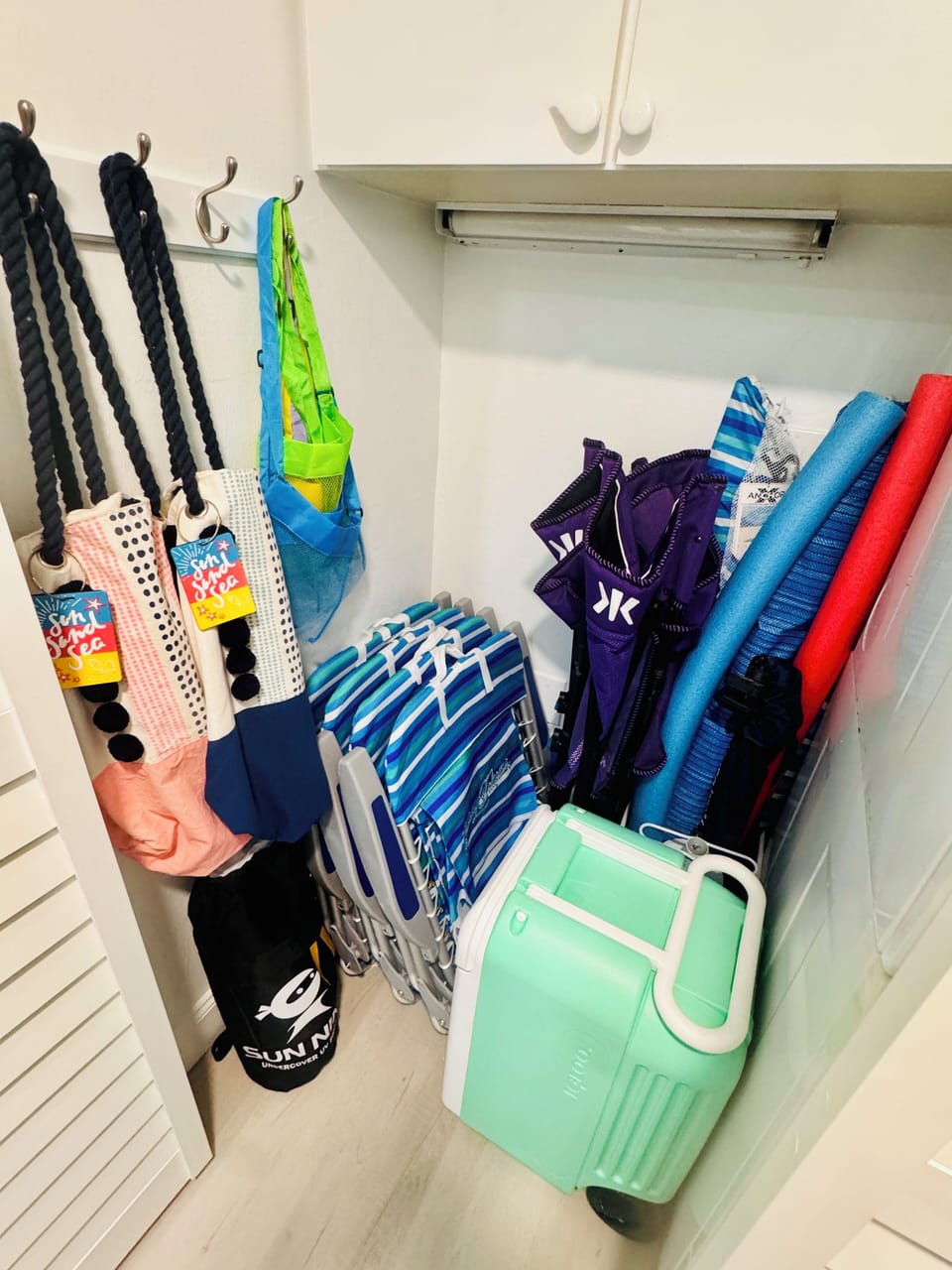 Beach chairs, totes, buggy, coolers, umbrellas, cabana & shelling scoop/bags.