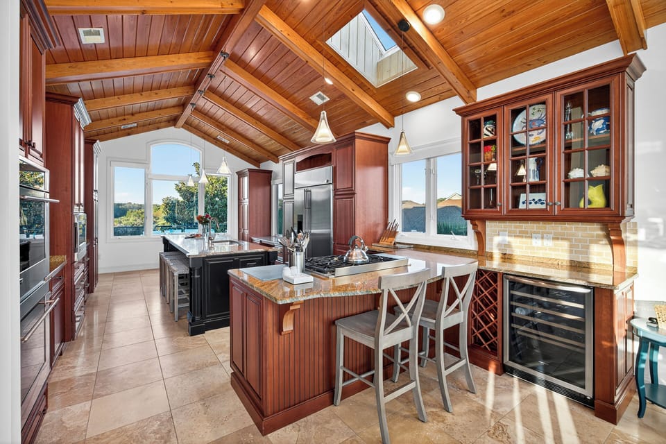 Bar stools for additional seating and a wine fridge