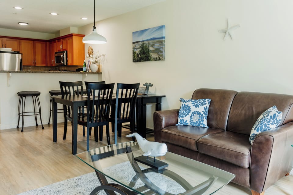 Dining area plus 3 bar seats at kitchen breakfast bar.
