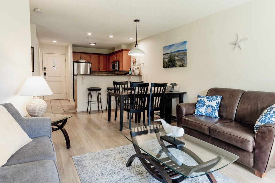 Dining area plus 3 bar seats at kitchen breakfast bar.
