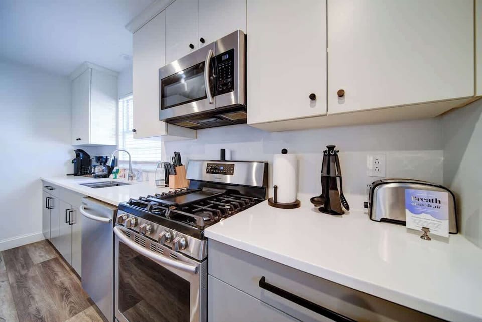 Fully equipped kitchen with essentials, cookware, and space to prepare meals comfortably.