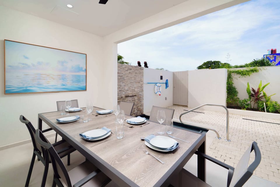 Kitchen: Open-concept living area with modern Caribbean flair, perfect for gatherings