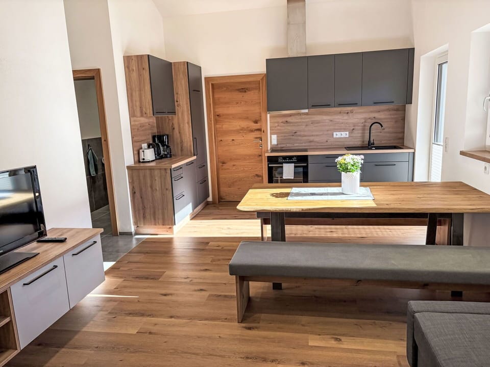 Furniture, Flooring, Interior Design, Wood, Floor, Wood Flooring, Cabinetry, Kitchen & Dining Room Table, Countertop, Table