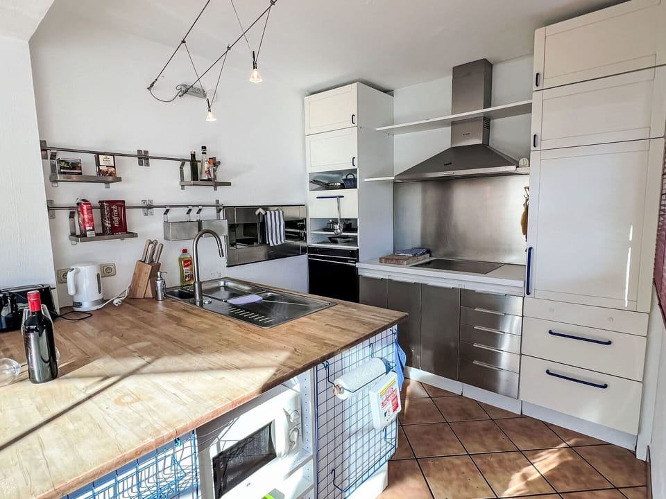 Kitchen, Furniture, Countertop, Kitchen Appliance, Cabinetry, Flooring, Major Appliance, Interior Design, Wood, Floor