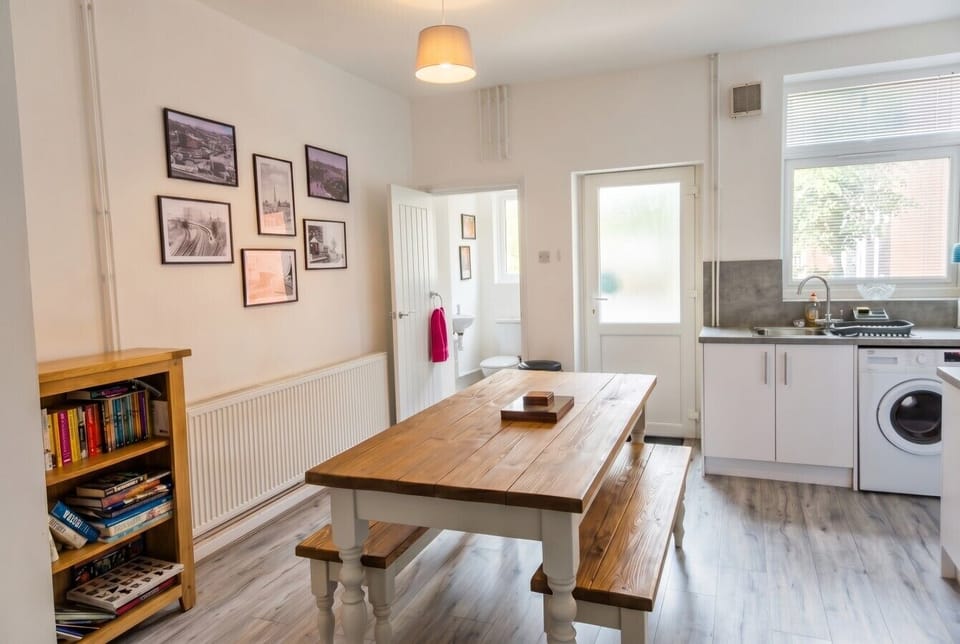 Bright kitchen-diner with farmhouse table and direct access to the garden.