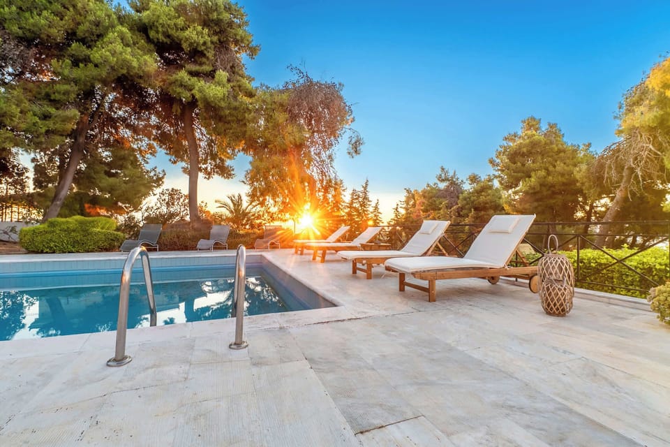 Tranquil Poolside Deck Surrounded by Mediterranean Greenery