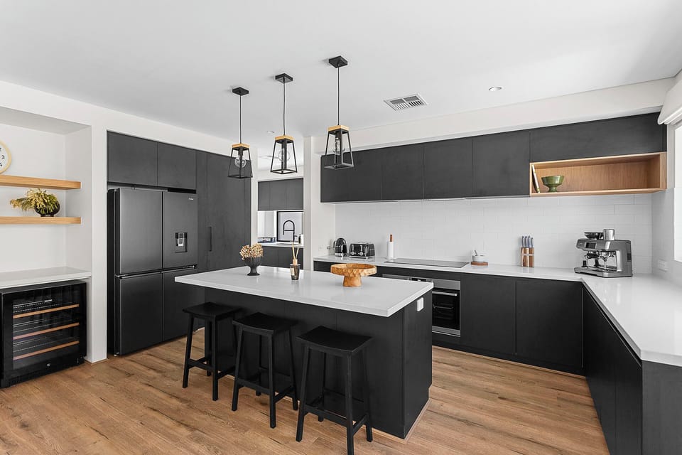 Kitchen with fridge, Freezer, coffee maker, kettle, bread toaster and stove