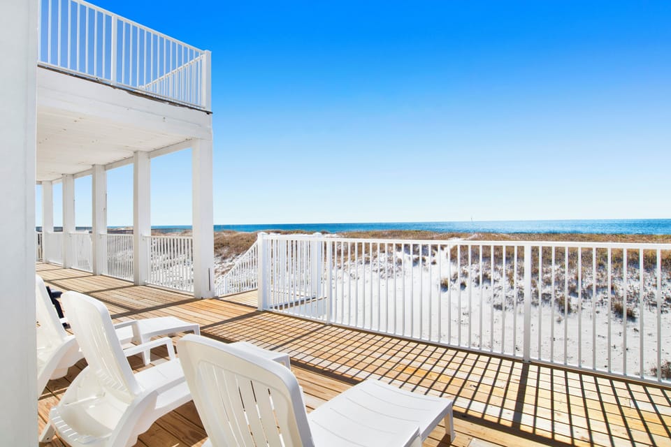 Featuring multiple balconies with unobstructed views of the Gulf and Little Lagoon