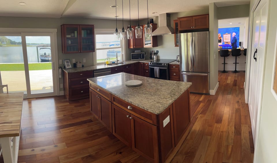 Kitchen features a large island for food preparation close to your group.