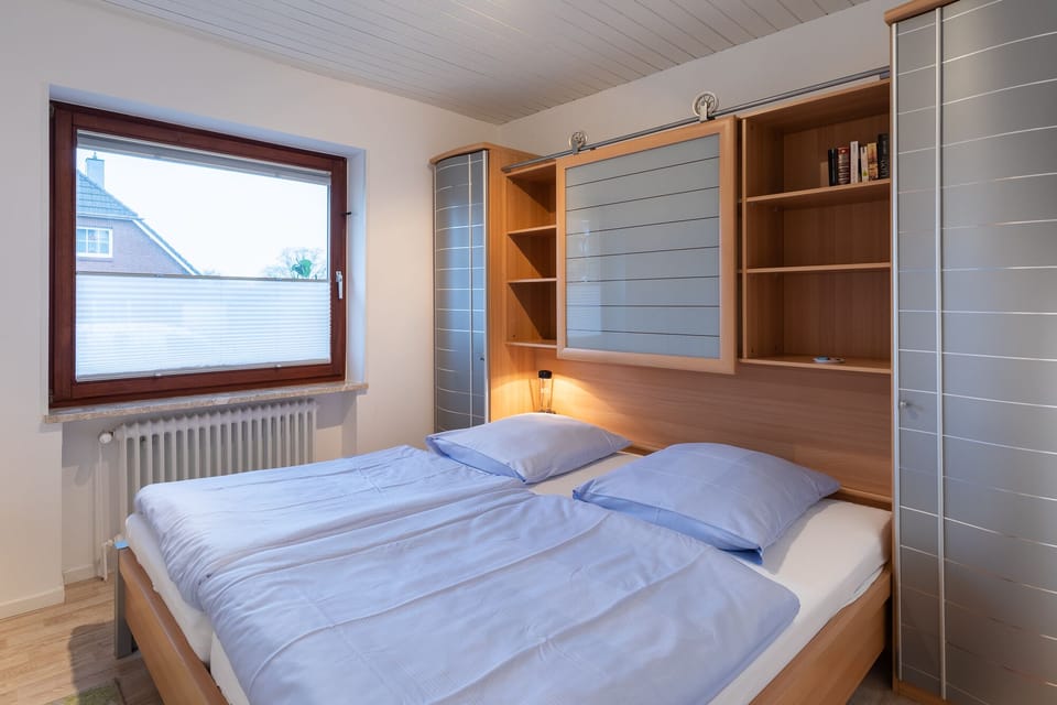 Bedroom with double bed and wardrobe