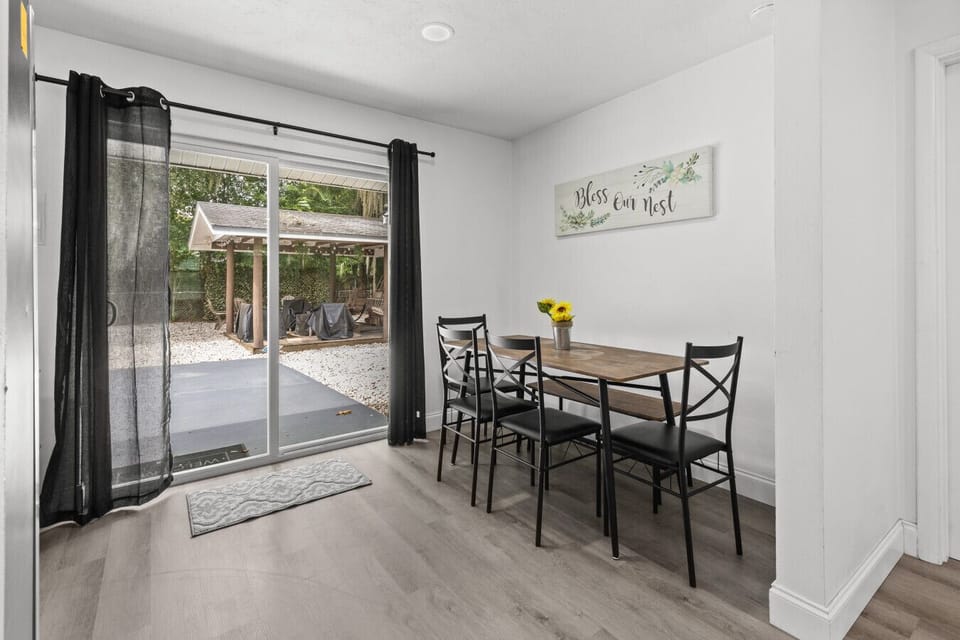 Bright dining area with natural light and easy outdoor access.