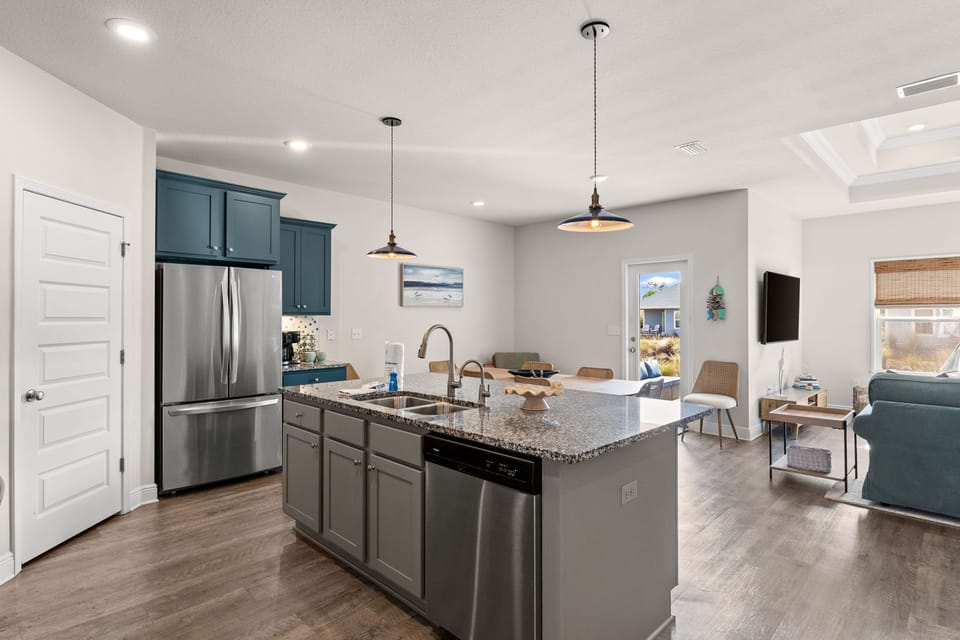 Your modern kitchen flows seamlessly into the living space, with granite countertops and stainless appliances perfect for preparing meals together.
