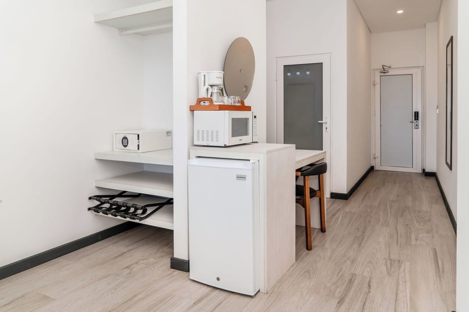 Clothing storage, mini fridge, microwave, coffee pot