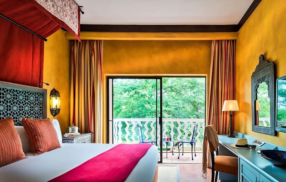 Soak in vibrant design and breathe in leafy balcony air.