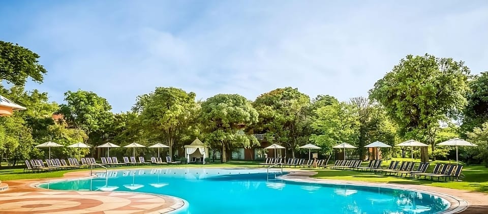 Soak up sunshine beside the expansive pool and loungers.