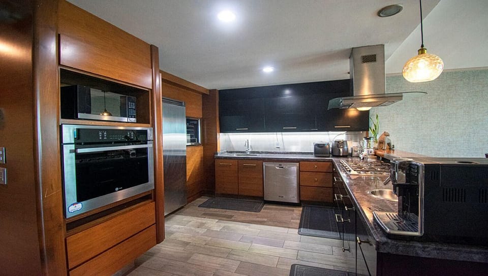 Sleek modern kitchen with stainless steel appliances and ample space