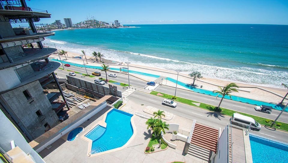 Oceanfront pool area with stunning beach and sea views